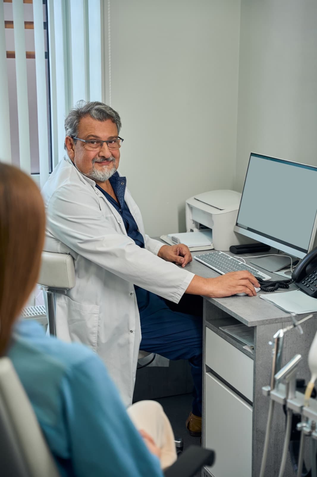 Clinic finance team working at a computer