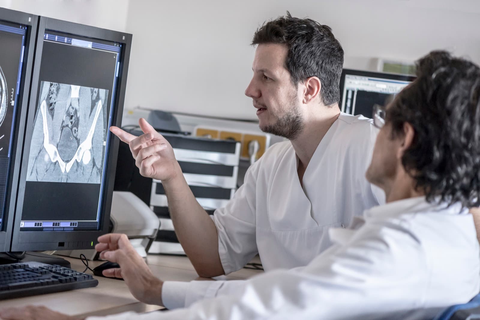 Healthcare clinicians reviewing medical imaging